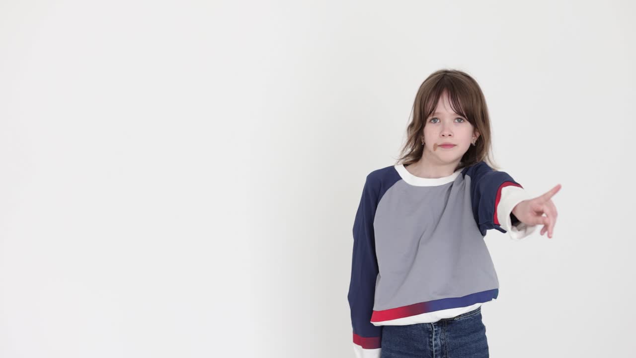 A young girl making gestures