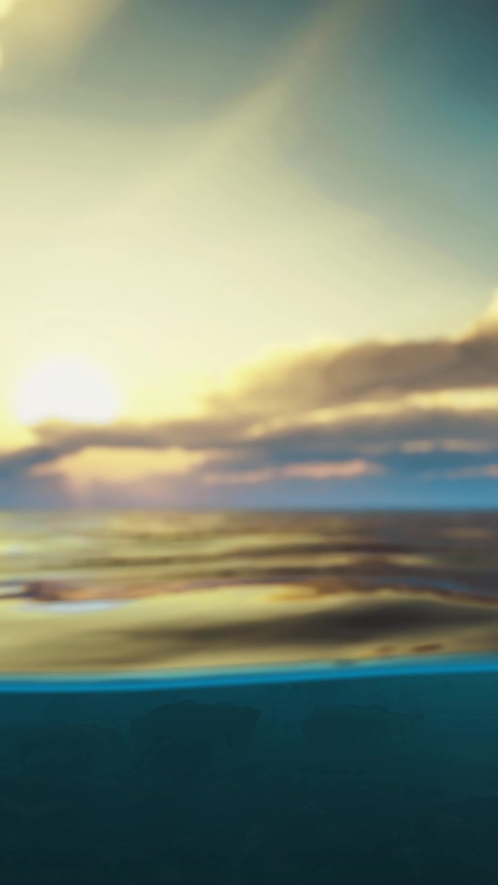 Sunset at the beach with water reflecting light in the evening sky