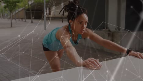 Network-of-connections-against-african-american-woman-performing-stretching-exercise-in-the-park