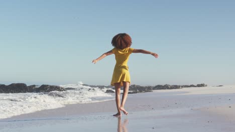 african american woman enjoying seaside