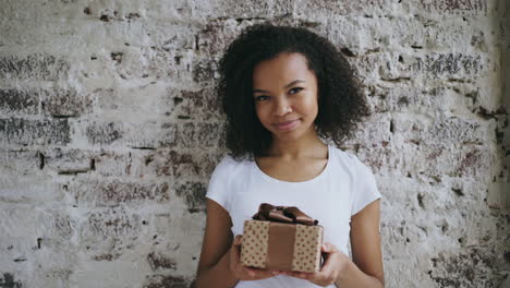 young woman holding a gift