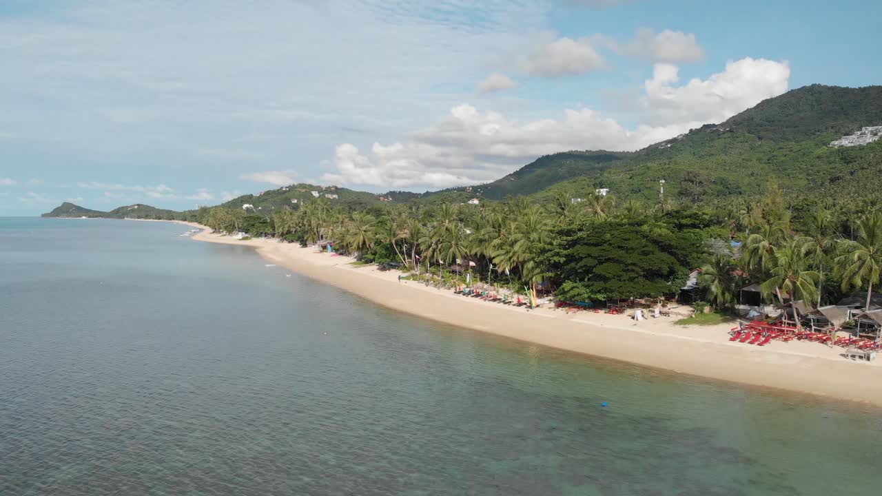 Calm and Serene Beach with Mountains and Palmtrees on Koh Samui Thailand