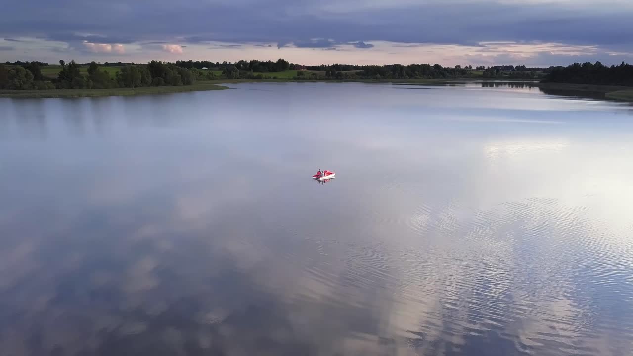 Family on a Pedal Boat on a Lake Drone Footage