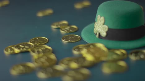 studio shot of green leprechaun top hat and piles of gold coins to celebrate st patricks day 6