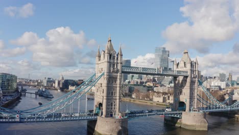 close up dolly back drone shot of tower bridge from the south on a sunny day