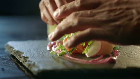 Chef-Preparing-a-salmon-meal-haute-cuisine