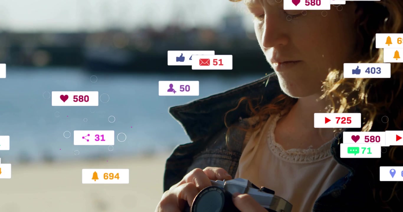 Woman holding camera on beach, mouse moving creating badges over camera, adjusting dials for ads