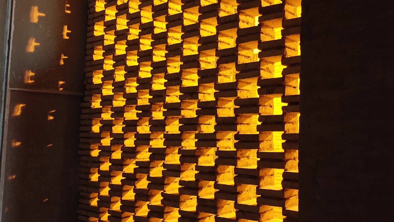 Sunlight Shining Through Decorative Brick Wall Pattern