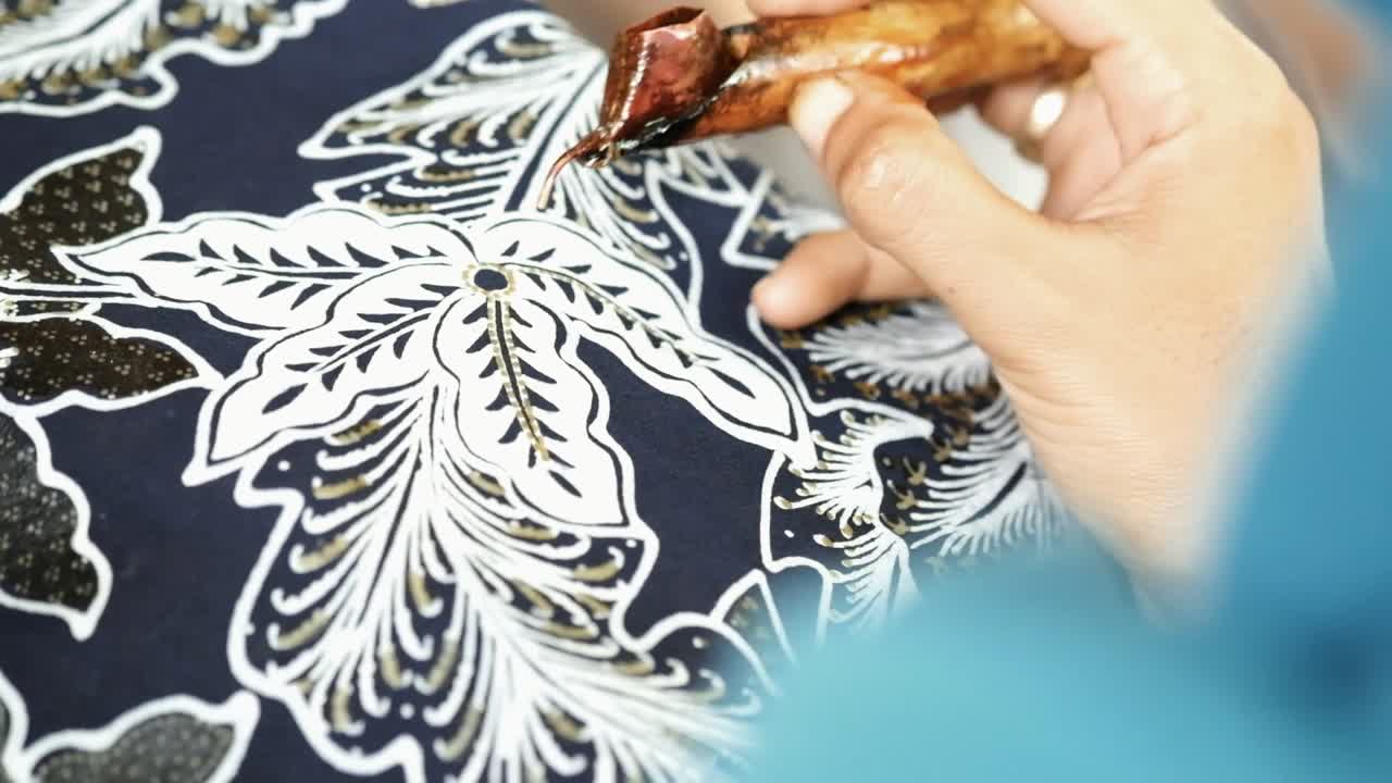 Close up, creating Batik traditionally hand made in Yogyakarta city