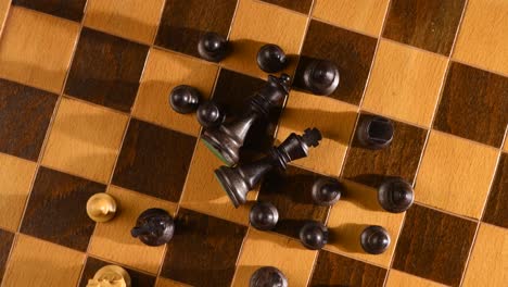 black chess set being surrounded by white set