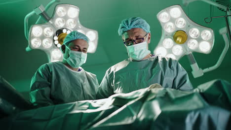 surgeons performing an operation in the operating room