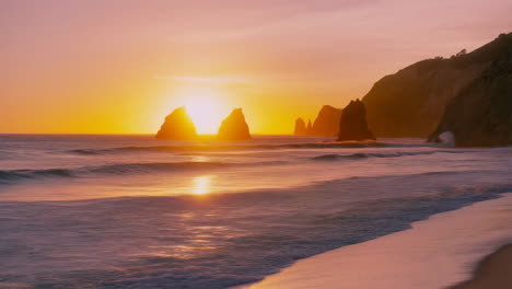 vibrant sunset over a coastal beach with sea stacks