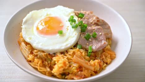 kimchi fried rice with fried egg and pork - korean food style