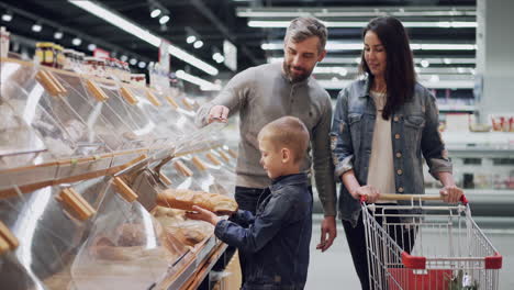 family shopping for bread at a grocery store