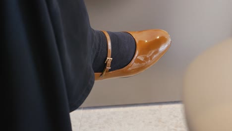 woman's brown shoe detail