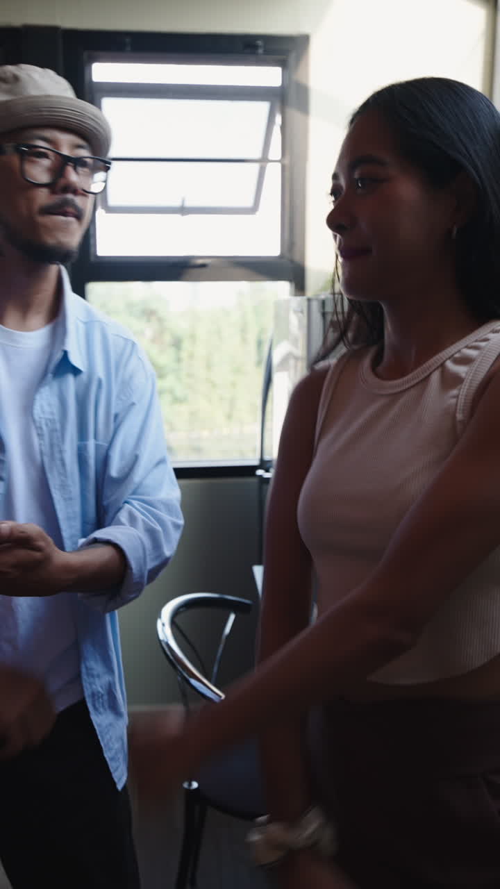 People indoors by the window