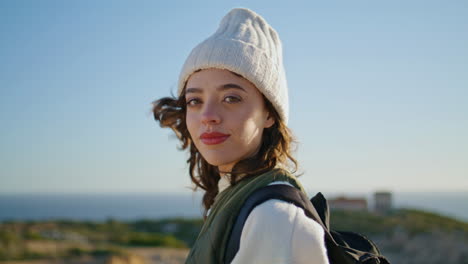 Walking-girl-looking-camera-traveling-vertical-closeup.-Smiling-tourist-texting