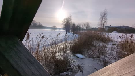 peaceful winter river landscape view from bridge, calm neighborhood winter scenery