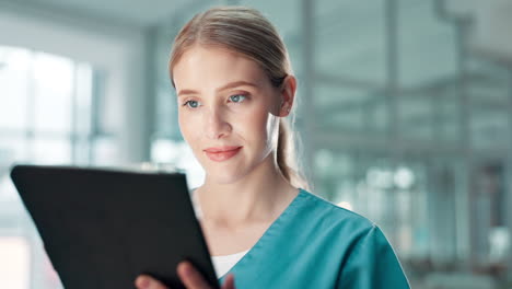 nurse using tablet in a hospital setting