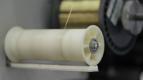 close-up of a yarn winding machine