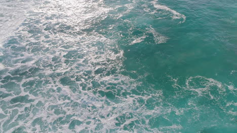 aerial shot of waves and swell at a beach in south australia