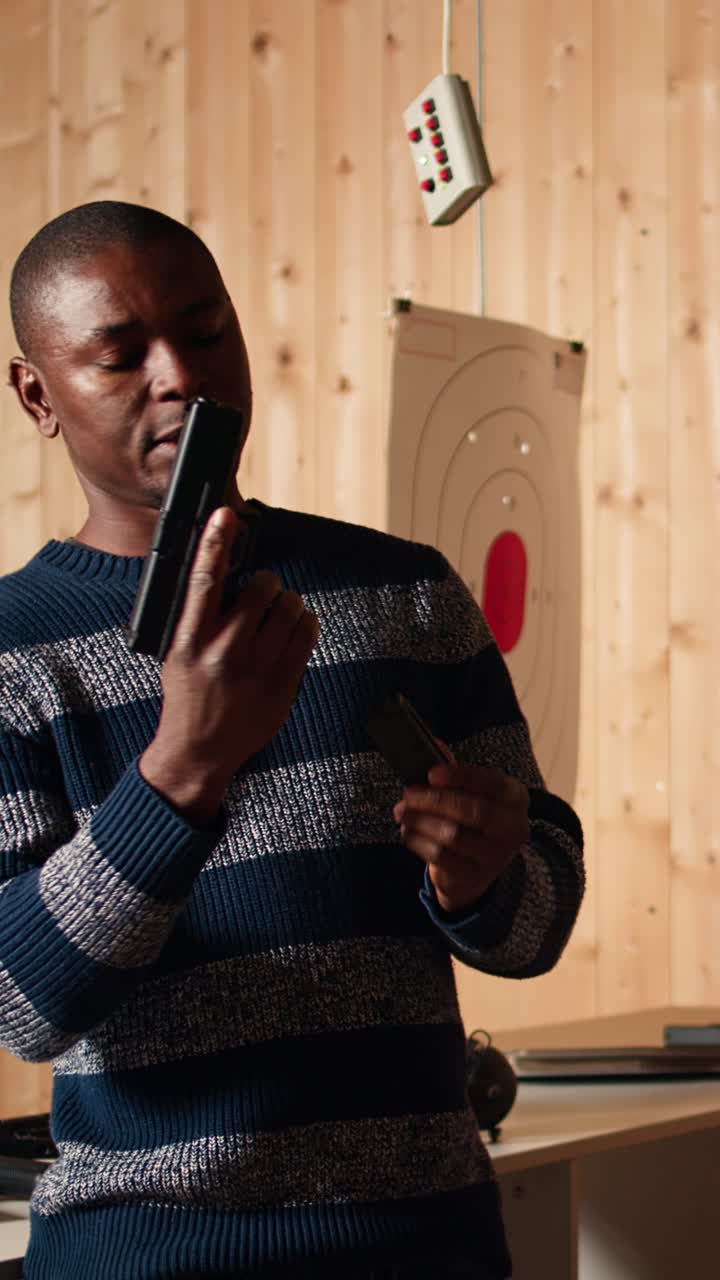Vertical video Shooting range safety officer shows how to reload pistol, following regulations