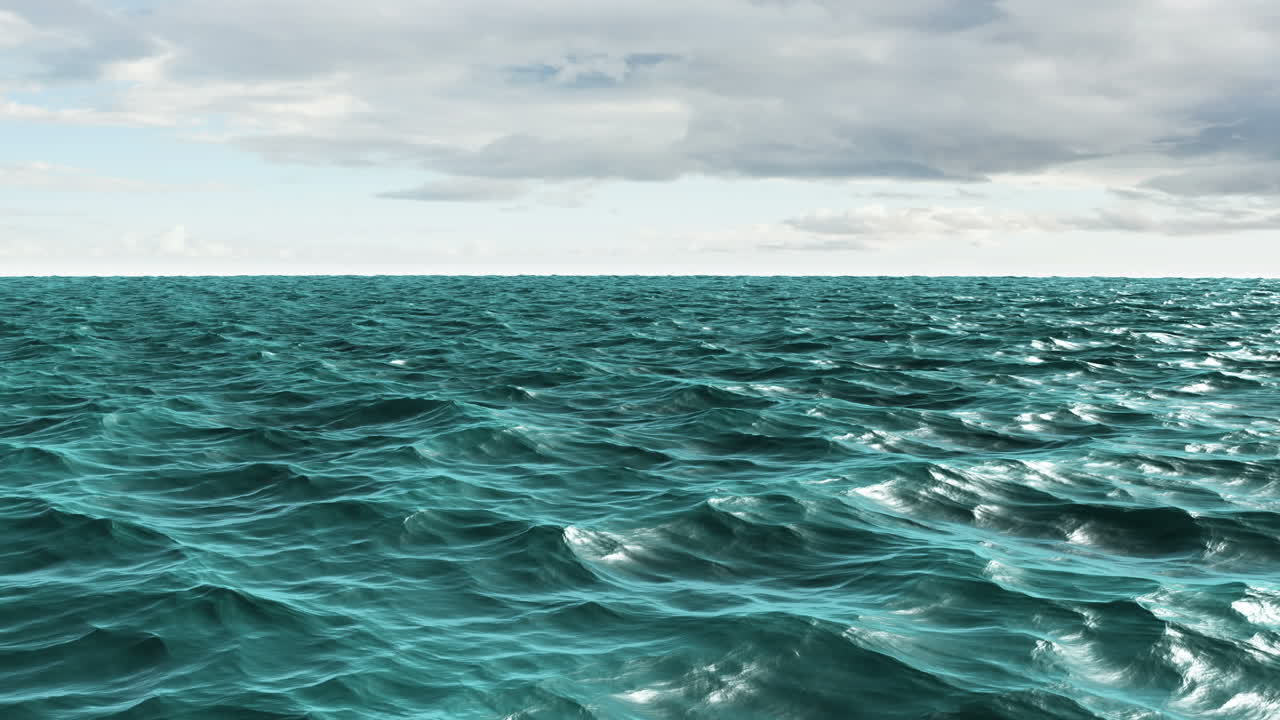 Choppy blue ocean under cloudy sky 