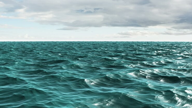 Choppy blue ocean under cloudy sky