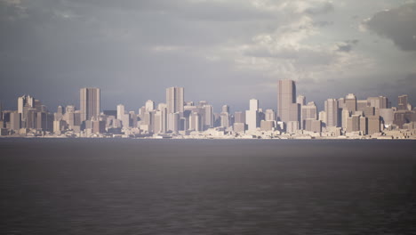 urban skyline view over calm waters under a cloudy sky at dusk