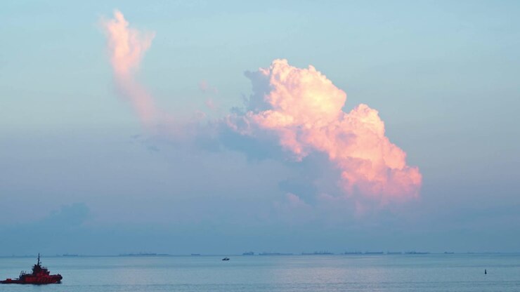 Sunrise over the Sea with Dramatic Clouds