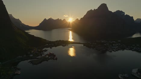 Glowing-sunset-and-silhouette-of-Norway-fjords,-aerial-view