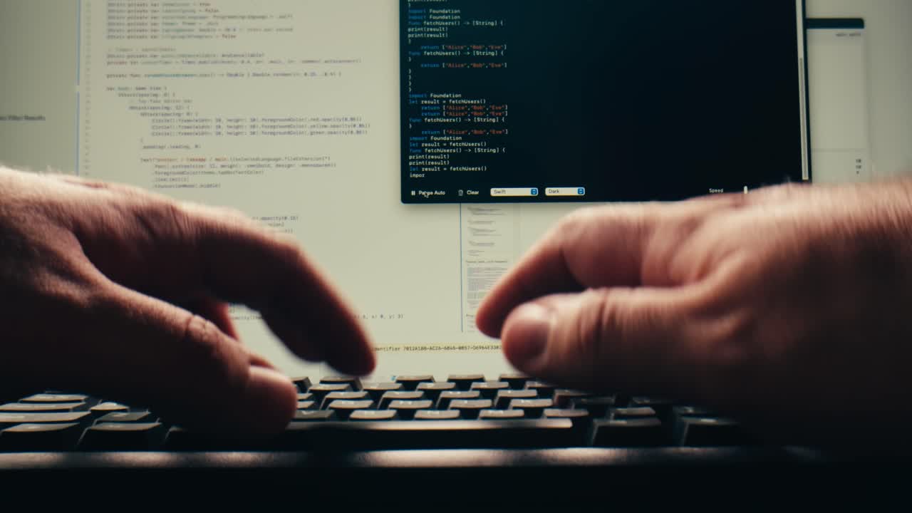 Close-up of Hands Typing Programming Code on Computer