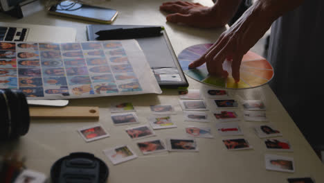 female graphic designer looking at color swatch 4k