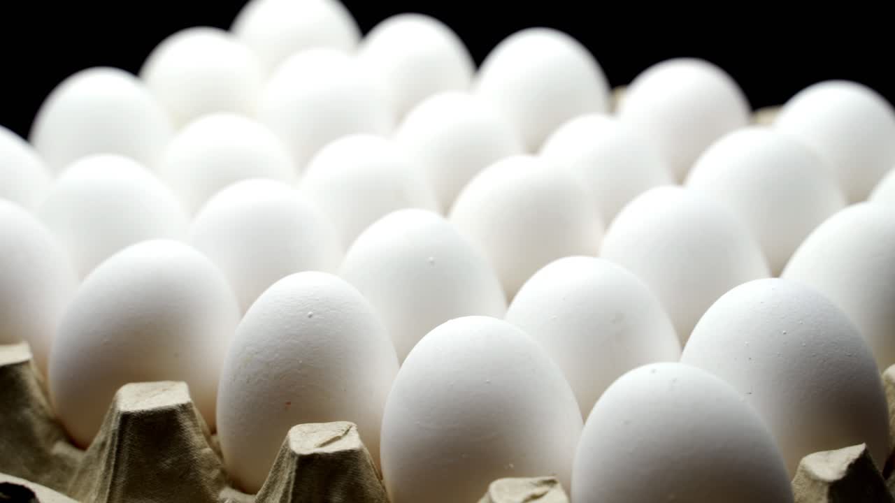 White chicken eggs in a cardboard box. Eggs in the container