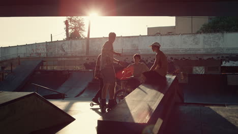 young guys communicating in skate park. riders discussing training session.