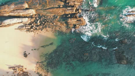 rowing boat aerial top down view on beautiful paradise rocky beach turquoise water