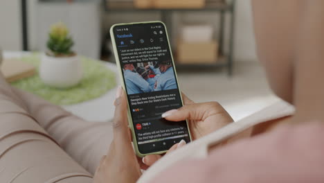 woman reading news on smartphone