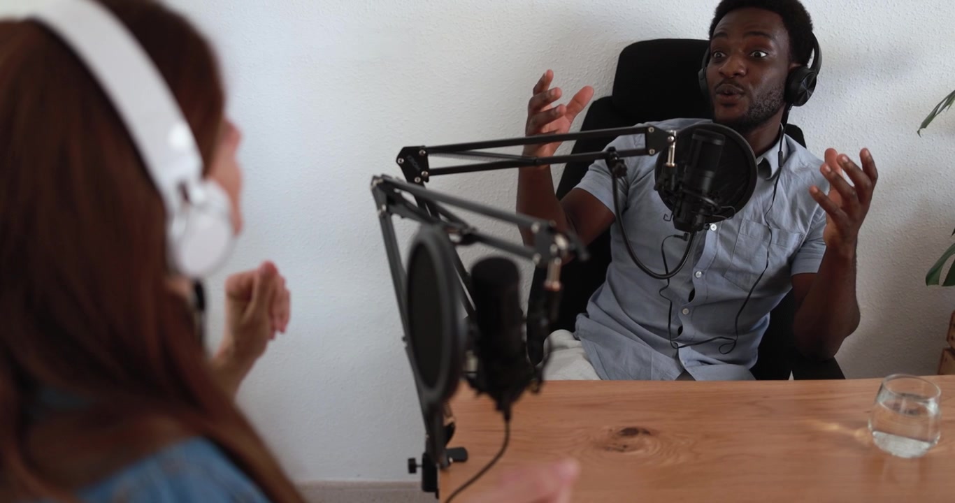 Two People Recording a Podcast Interview in a Studio