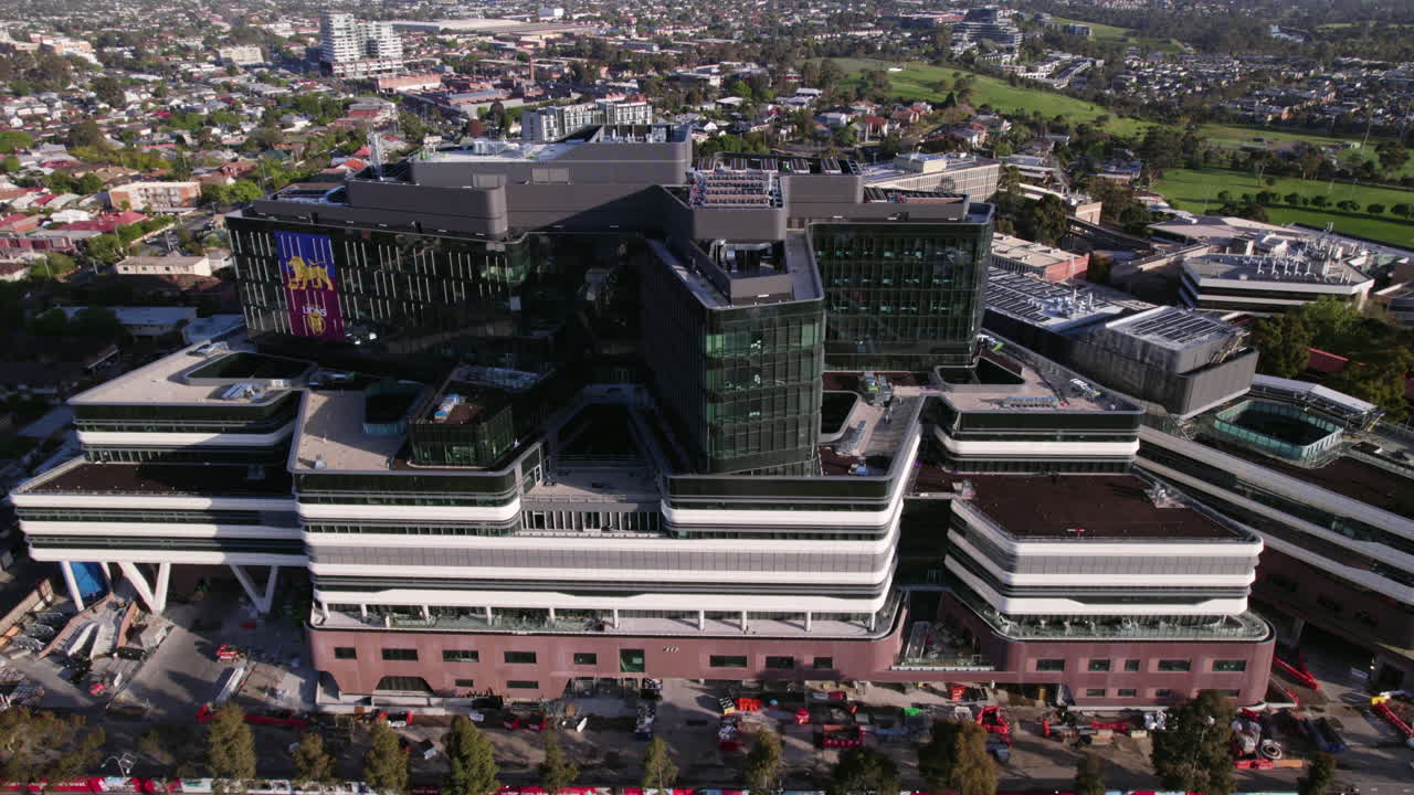Drone tilting toward the Melbourne Footscray Hospital, sunny day in Australia