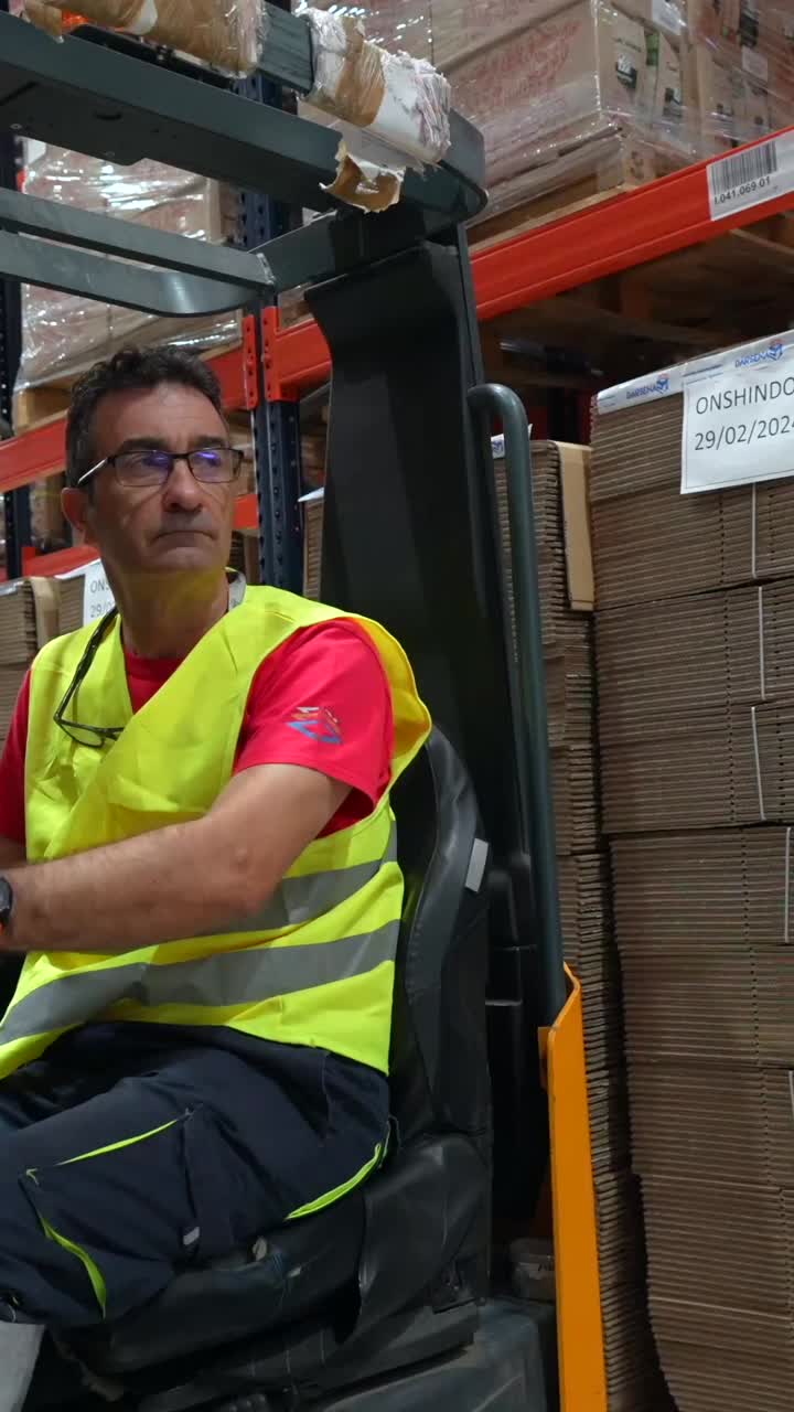 Man operating forklift in warehouse