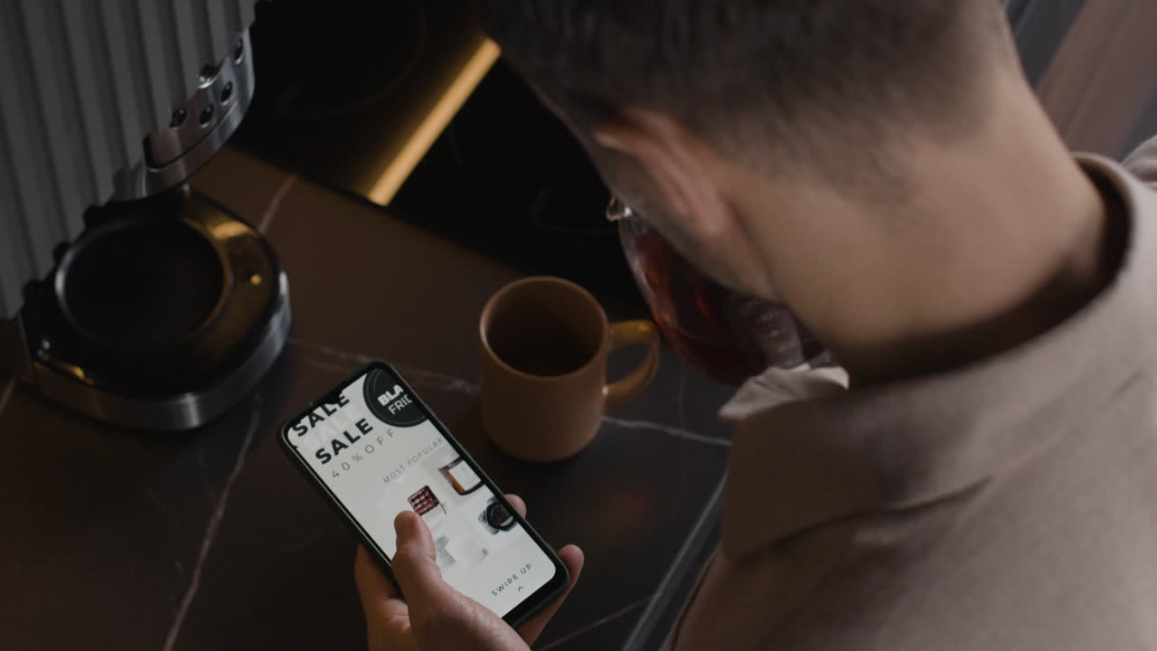Man browsing Black Friday sale on smartphone