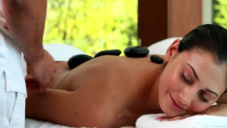 Relaxed-friends-enjoying-hot-stone-massages