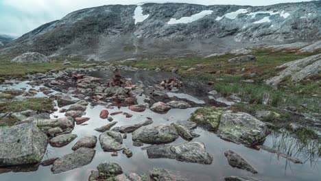 a shallow stream with a rocky bottom in the mountainous plateau