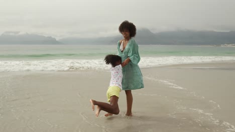 family enjoying free time by the sea