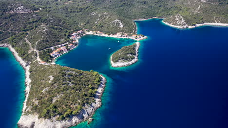 green forest in lastovo island and blue water of adriatic sea in croatia. - aerial drone