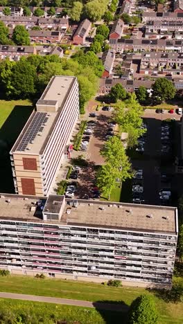 aerial view of residential buildings and parking lots in an urban area