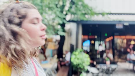 young woman vlogging her exploration of athenian urban life