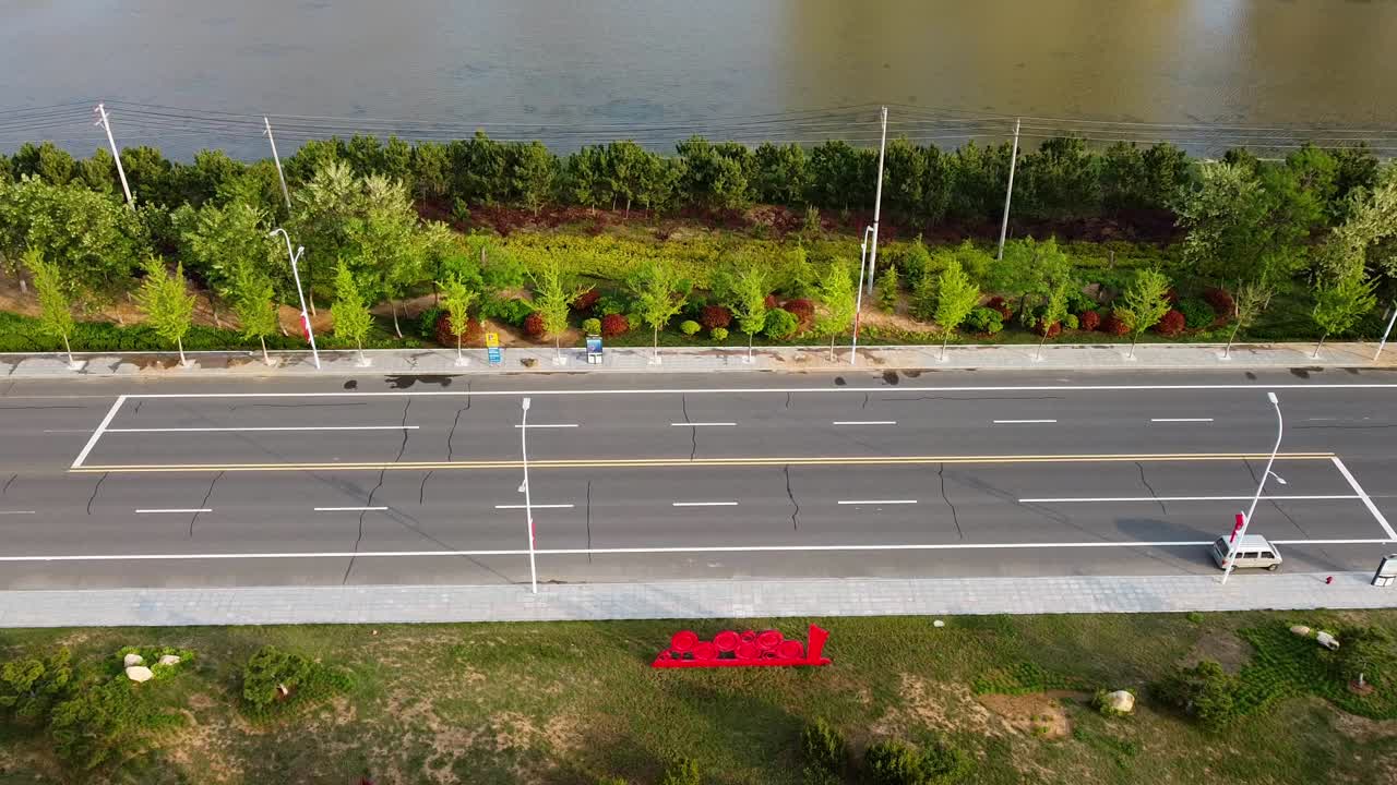 Descending view of highway traffic filmed in Nanhai New District, Shandong Province, China