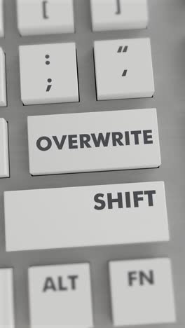 presionar el botón de sobrescripción en el teclado vídeo vertical