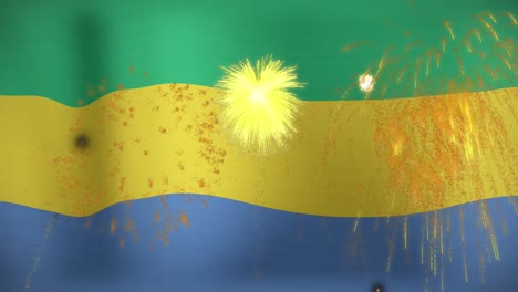 animation of fireworks display exploding over flag of gabon